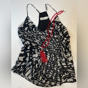 Black and white spaghetti strap top. Dressy or casual. EUC, no damage.